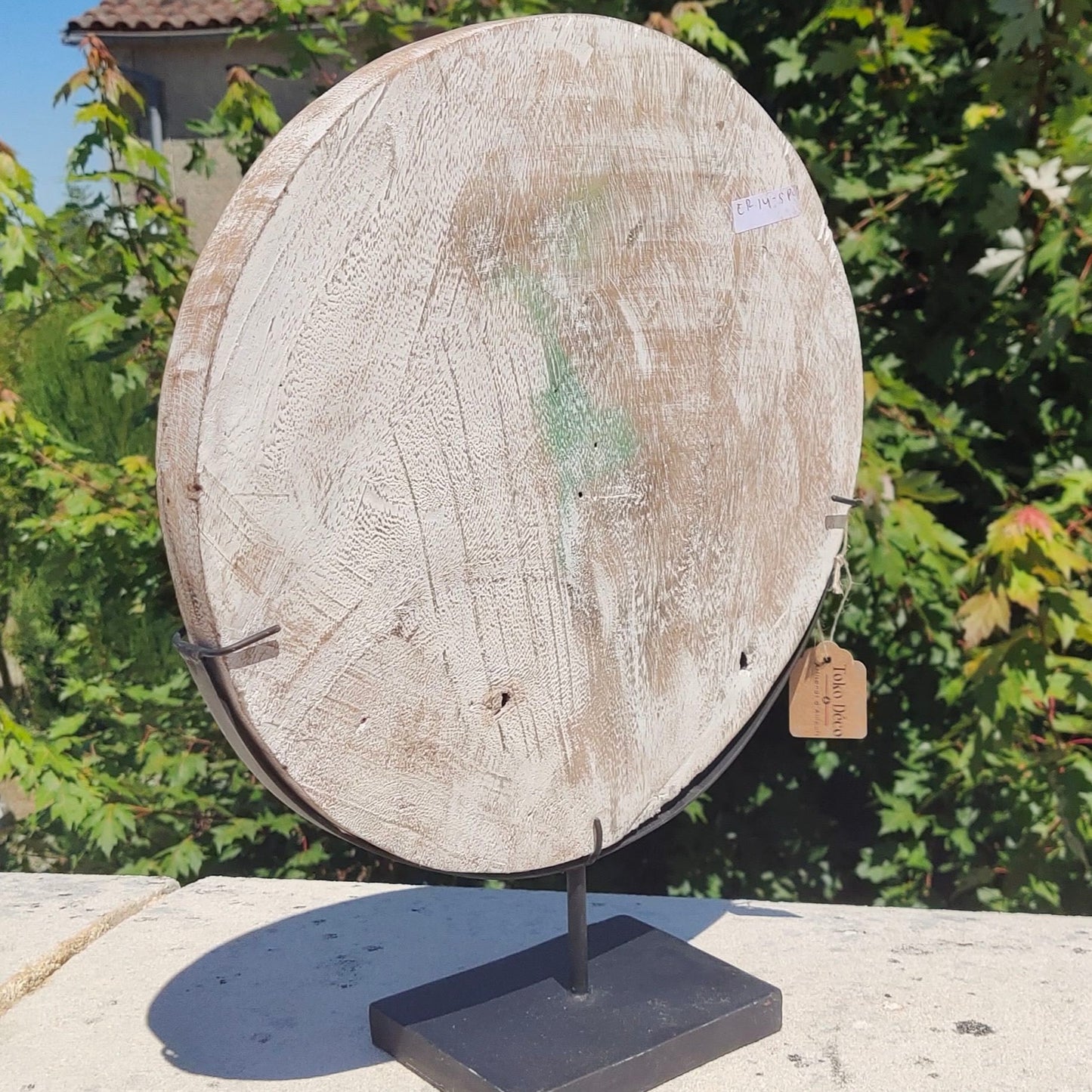 Sculpture primitive sur disque en bois